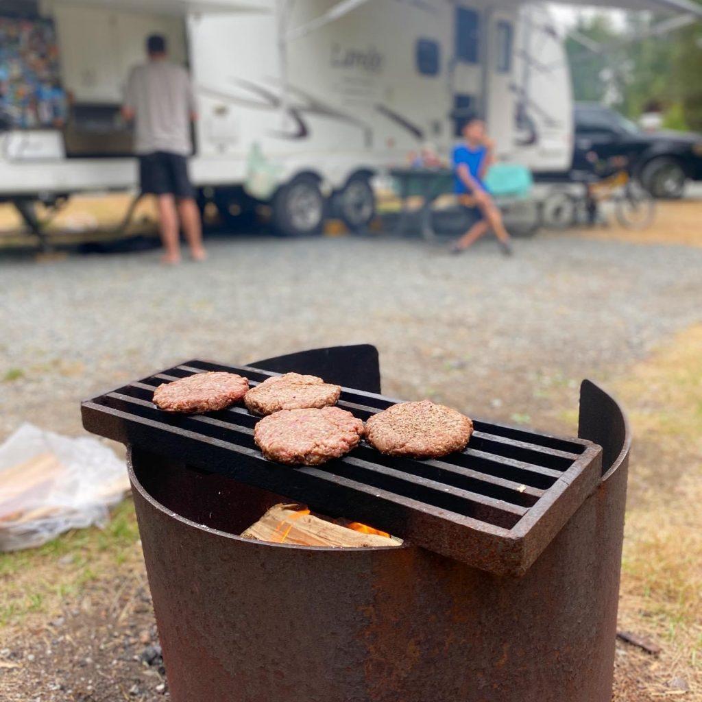 cooking on a campfire outside our RV