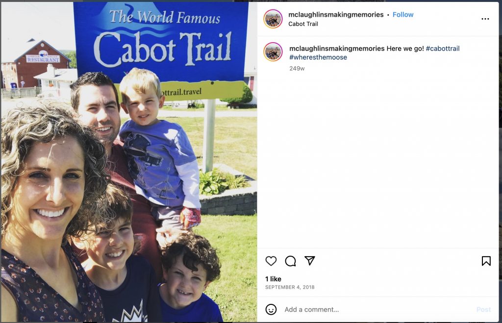 standing in front of the cabot trail sign in Eastern Canada