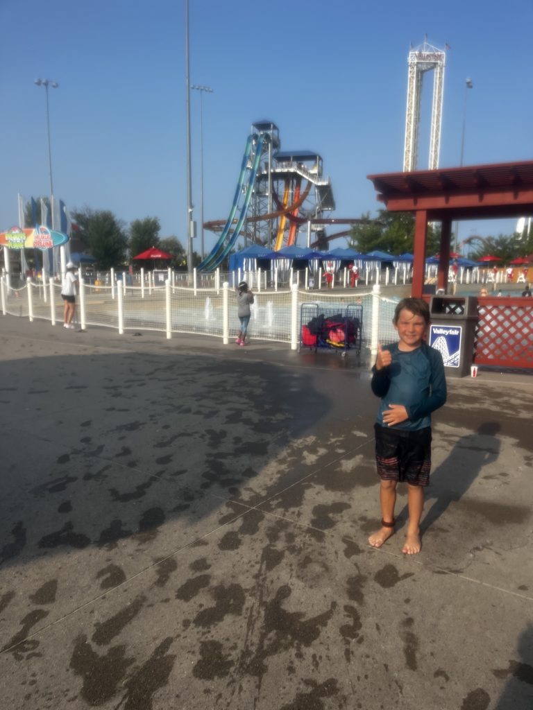 Ian standing outside of the Wave Pool in Soak City at ValleyFair MN!