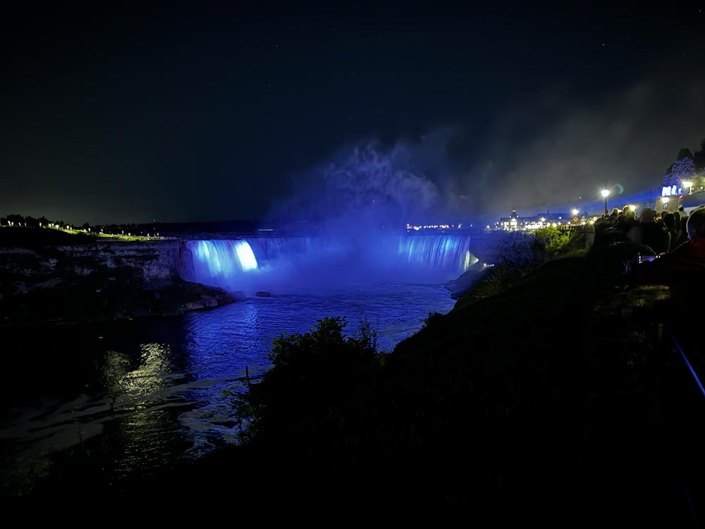 Horseshoe falls lit up blue at night