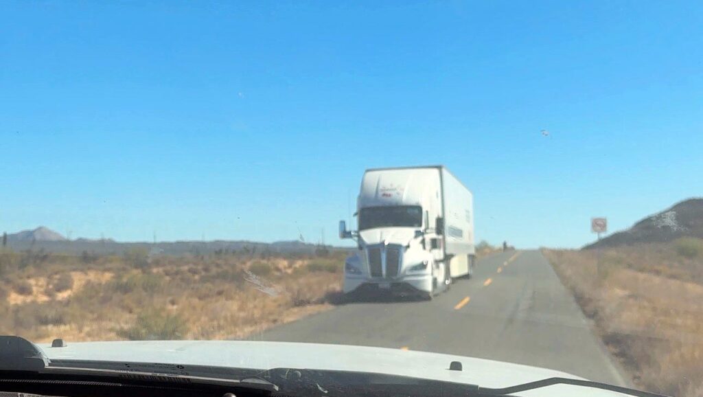 A semitruck is pulled over on a Baja highway