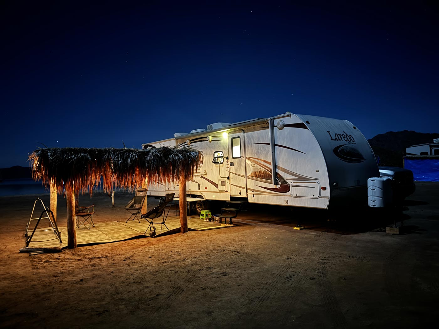 RVing at Playa Santispac at night with our palapa