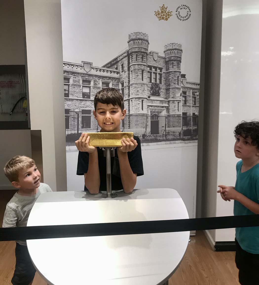 Lifting a gold bar at the Royal Canadian Mint in Ottawa