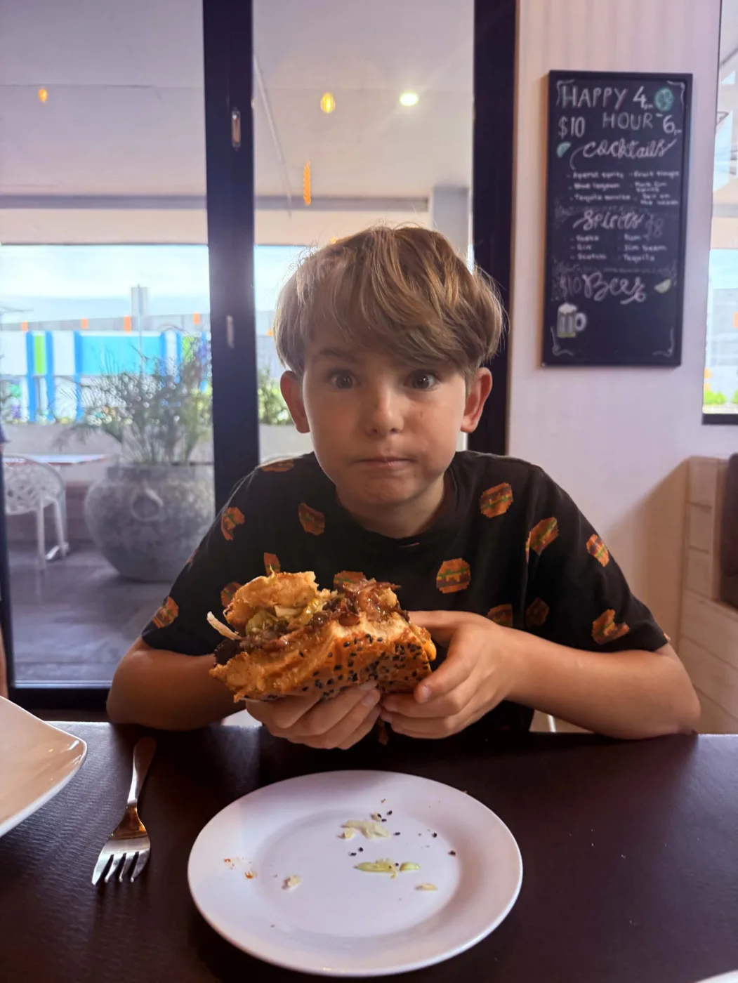 Biting into Burgzilla t Burgery Bar